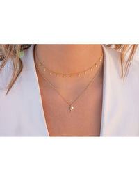 Collar con colgantes en forma de rayo con circonitas y estrella