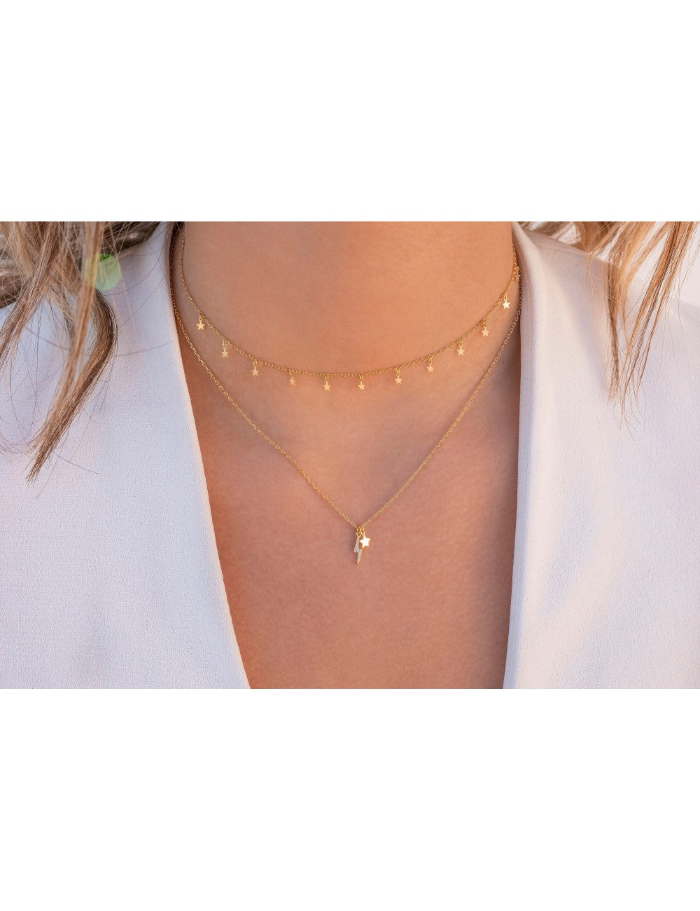 Collar con colgantes en forma de rayo con circonitas y estrella
