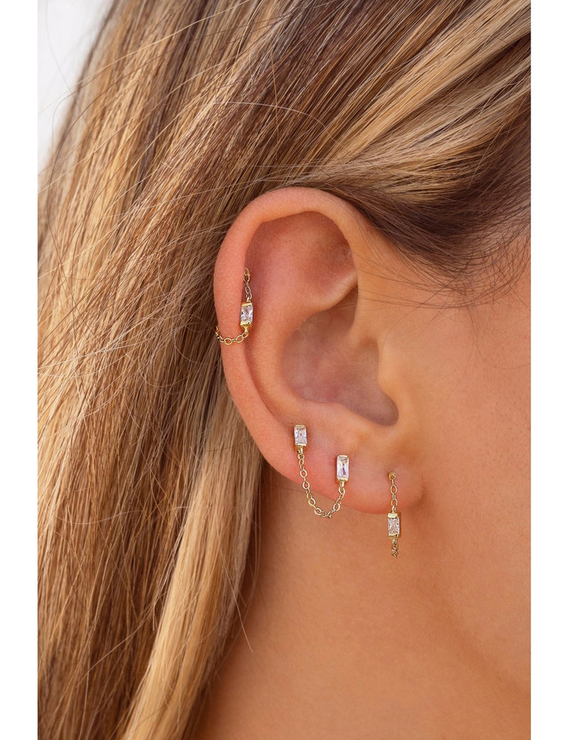 Pendientes stud piercing doble de circonitas en talla baguette con cadena