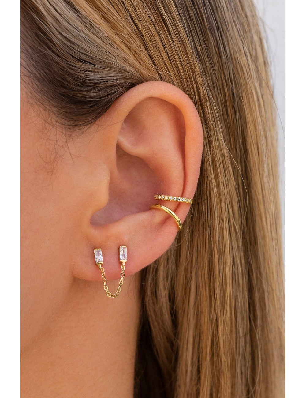 Pendientes stud piercing doble de circonitas en talla baguette con cadena