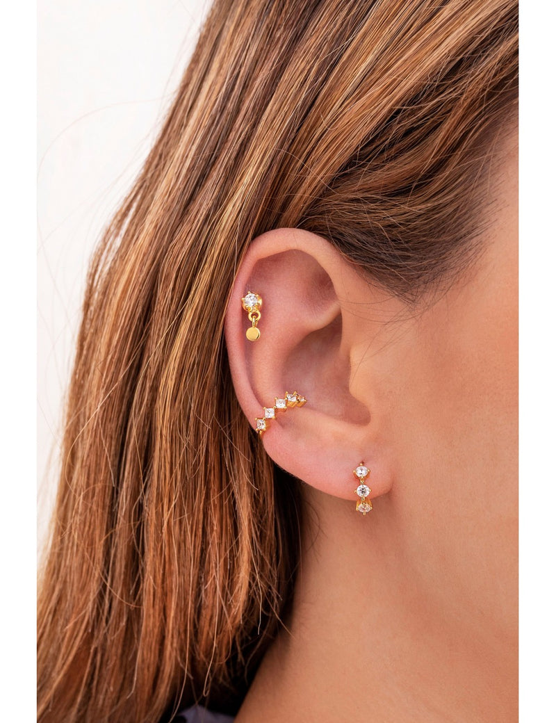 Pendientes de aro huggie con 3 circonitas engastadas en 4 garras